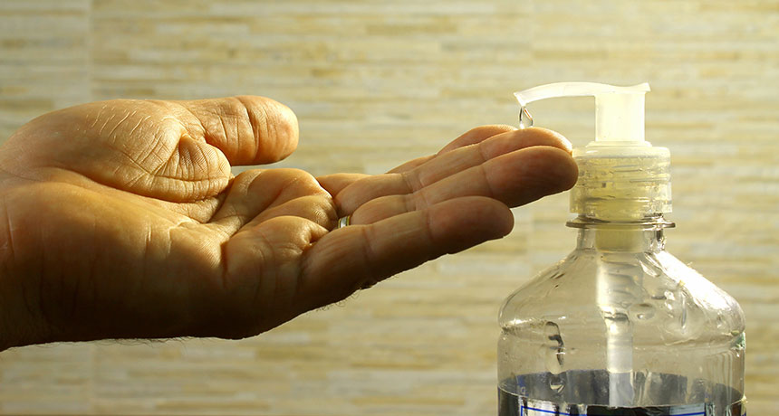 using hand sanitizer