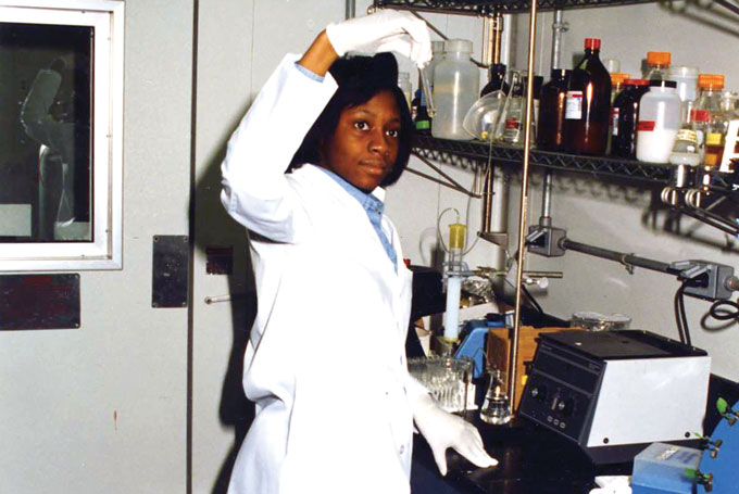 Fatima Cody Stanford holds up a test tube in a laboratory